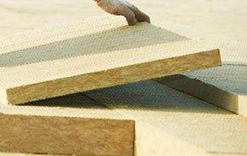 measuring Juniper Green tapered insulation